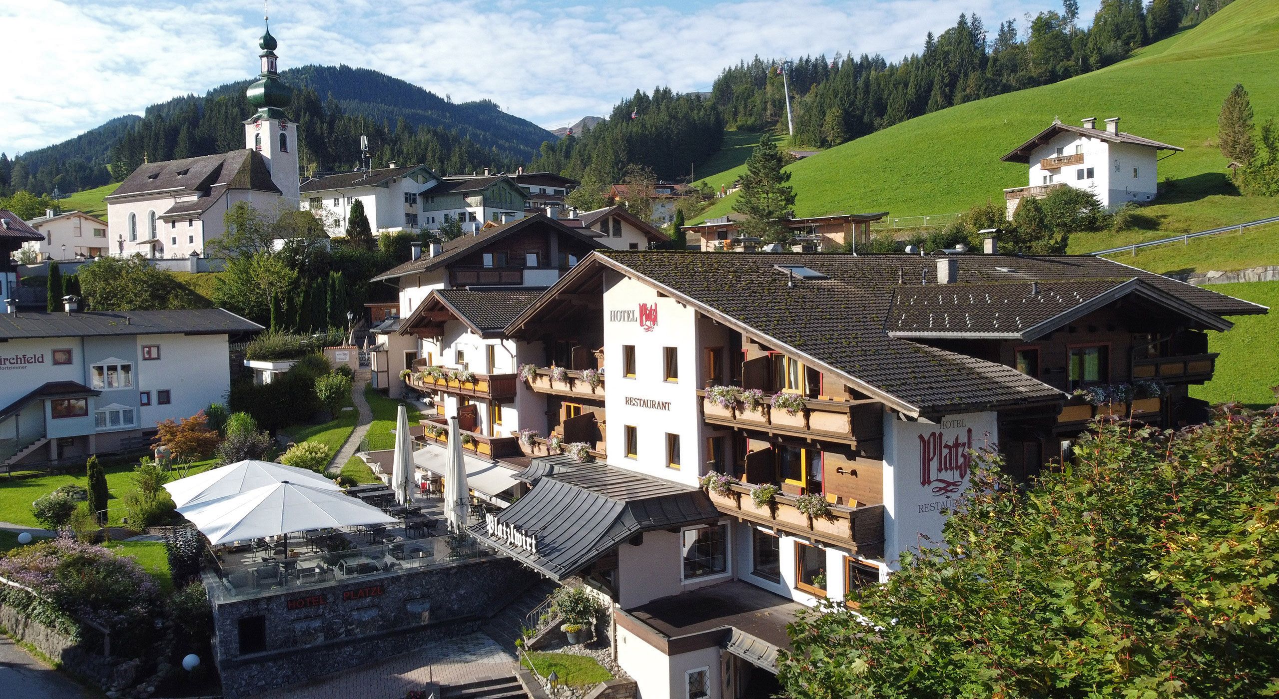 Hotel Platzl in Auffach during summer with terrace and mountain panorama in Tyrol